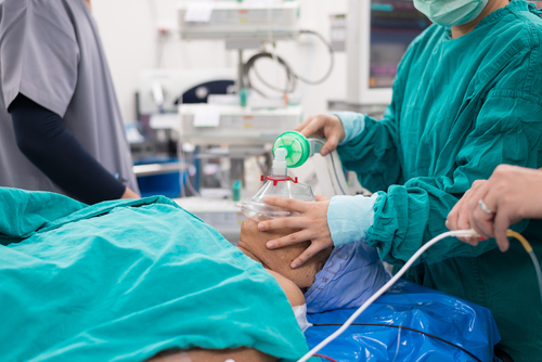 A patient is being treated in an operating room.