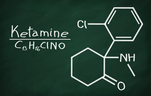 A chalkboard with a chemical structure.