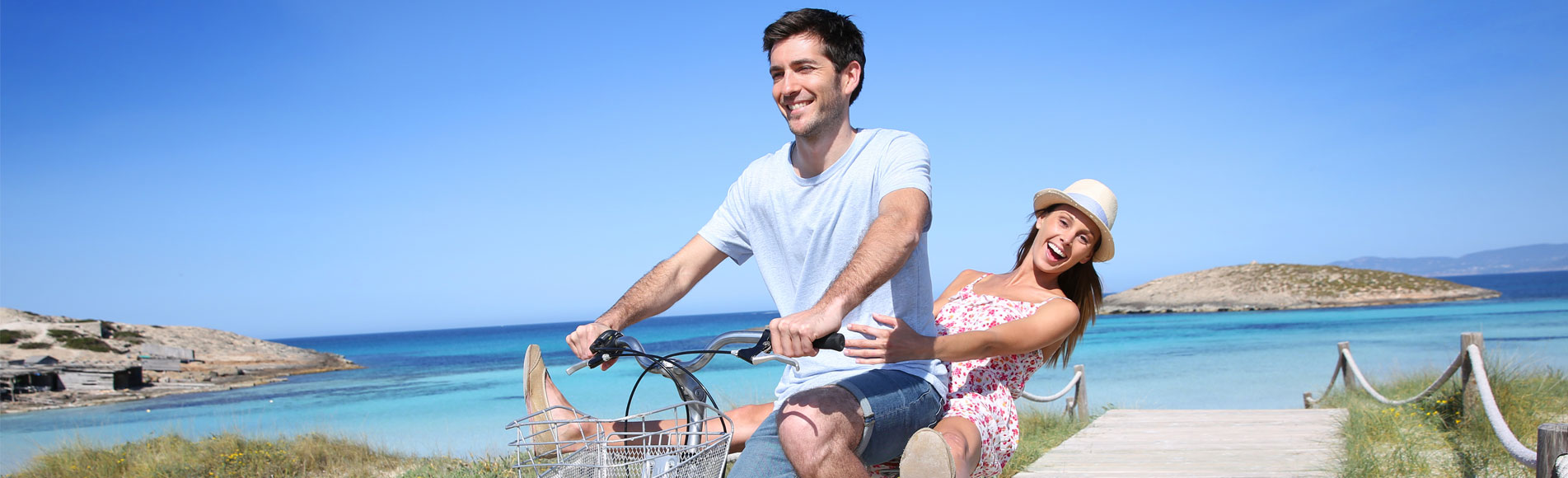 A man and woman on a bicycle.